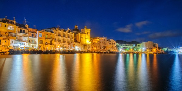 Ischia town at night. Mediterranean Sea coast, bay of Naples, Ischia island, Italy